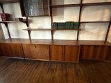 a book shelf with books on it in a room
