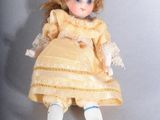 a small doll that is sitting on a table