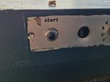 a close up of a machine that has some screws on it