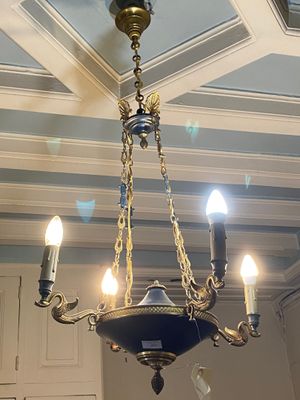 a chandelier hanging from the ceiling in a room