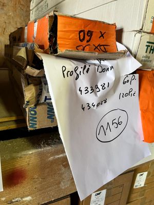 a piece of paper on top of a pile of boxes