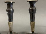 two candles that are sitting on a table