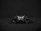a close up of a toy car with a skull and crossbones on it