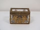 an image of a gold and glass box with angels on it