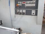 a machine that has a bucket in front of it