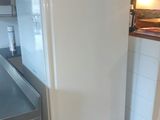 an image of a kitchen with a refrigerator in it