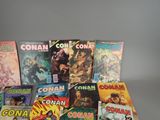 a lot of comic books sitting on a table