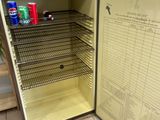 a small refrigerator with a lot of food inside of it