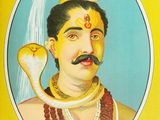 a picture of a man with a snake on his head