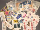 many different types of stamps on the table