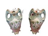 two vases that are sitting side by side on a white background