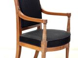 a black chair with a wooden frame and a black upholstered seat