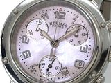 a close up of a wrist watch with a pink dial