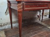 a wooden desk with a drawer on top of it