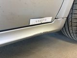 a close up of a car ' s bumper with a sticker on it