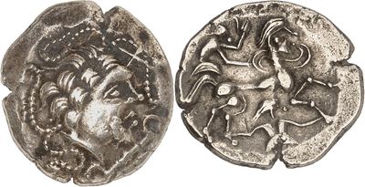 a silver coin with an image of a man on it