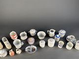 many different types of cups and saucers on the table