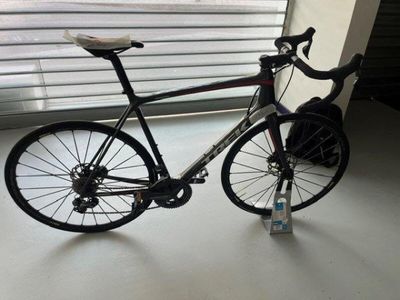 a bike that is sitting on the floor by the window