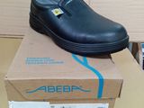 a black shoe that is on top of a box