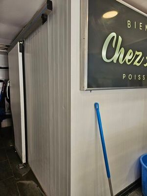 a blue bucket sitting in front of a sign that says overdrive post office