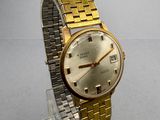 an image of a gold and silver watch on a clear acrylic stand
