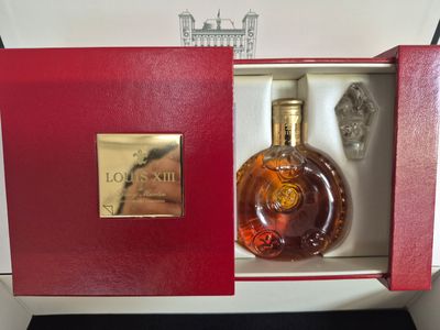 an image of a bottle of liquor in a red box