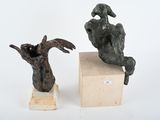 two sculptures that are sitting on top of each other