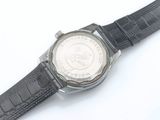 a close up of a wrist watch on a white surface