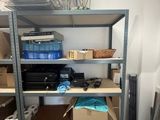 many boxes and boxes on the shelves in the room