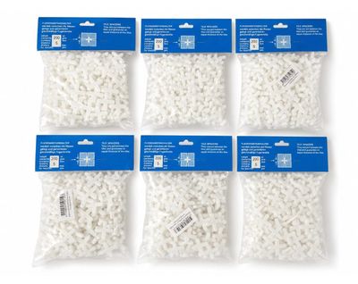 a set of four bags of white plastic beads on a white background