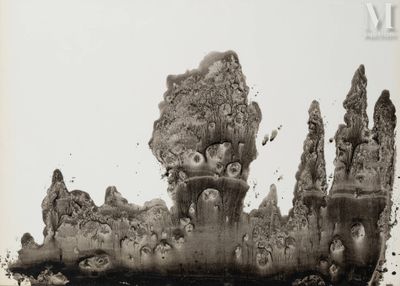 a black and white photo of a castle made out of dirt