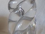a clear glass vase with a spiral design on it