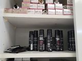 a white cabinet with many different types of cosmetics on it