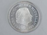a close up of a coin on a white surface