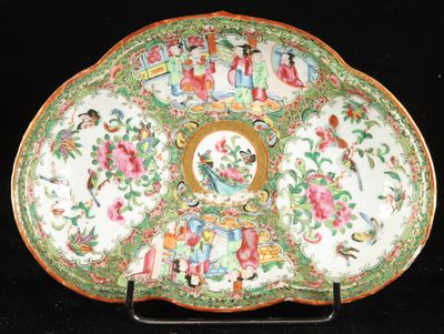 a plate with a decorative design on it on a black surface