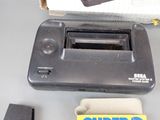a black toaster sitting on top of a table next to a box of soap