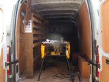 the back of a van with a table in the back of it