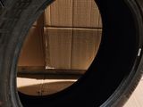 tires are stacked on a cardboard box in front of a cardboard box