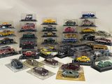 a lot of toy cars that are in a display case