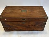 an old wooden box sitting on top of a white surface