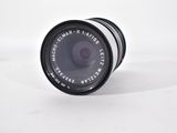 an image of a close up of a camera lens on a white surface