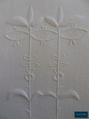 embroidered flowers on a piece of white paper with a blue border