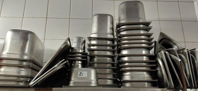many pots and pans stacked on top of each other
