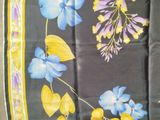 purple and blue flowers on a black background with yellow border