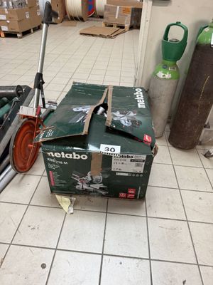a box that is sitting on the floor next to a scooter