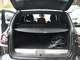 the back of a car with its trunk open and a bunch of wires in the trunk