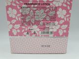 the back of a pink box with white flowers on it