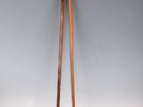 a pair of wooden chopsticks sitting on top of a table