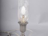 a lamp that is sitting on a table next to a cord