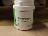 a bottle of propolisis sitting on a table